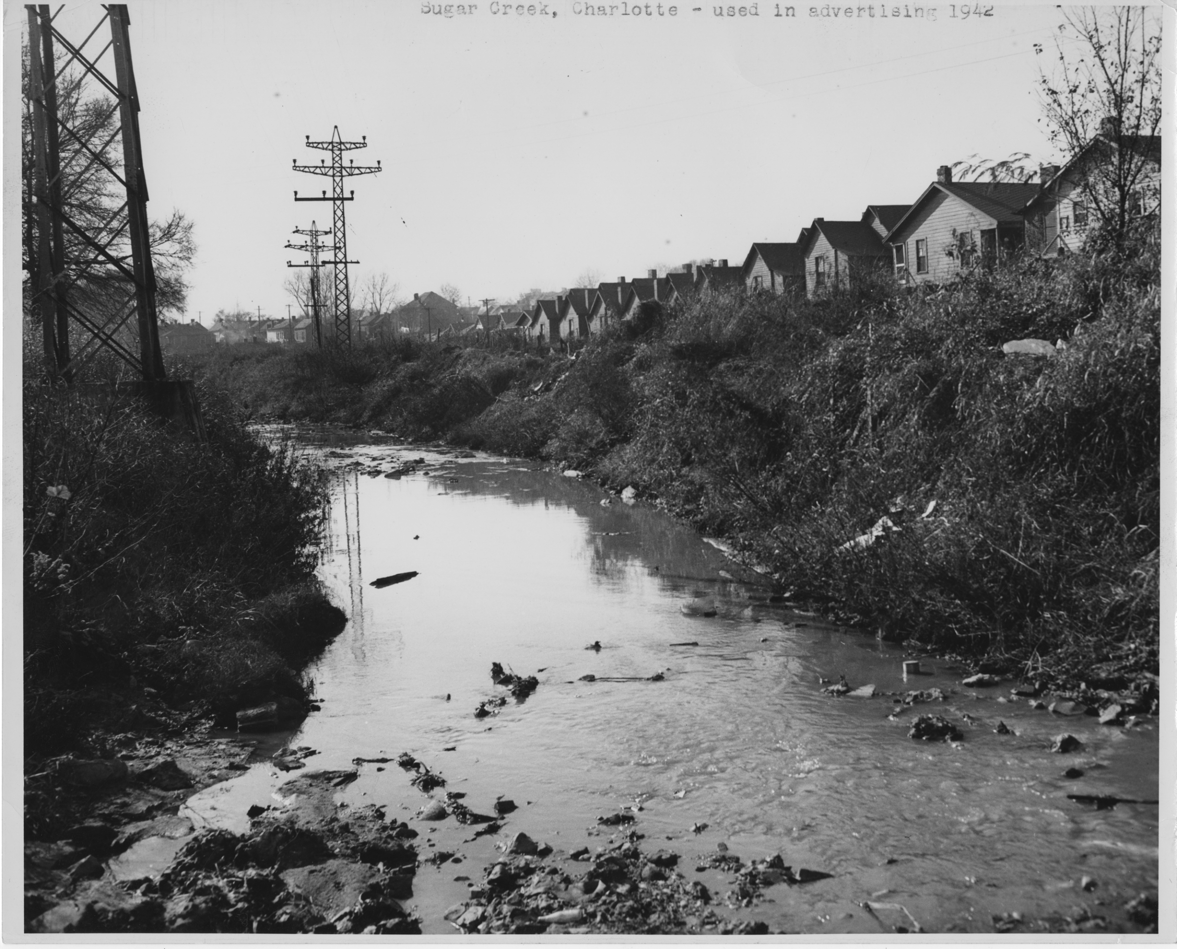 1942 image of houses near Little Sugar Creek. Photo courtesy Photo courtesy of Beaumert Whitton Papers, UNC Charlotte Atkins Library 