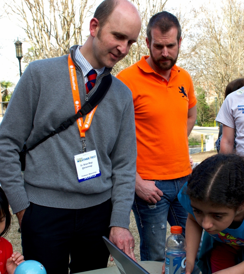 Brian Magi with students at Weatherfest, a 2015 celebration at UNC Charlotte of weather-related information. Photo: Lynn Roberson, UNC Charlotte